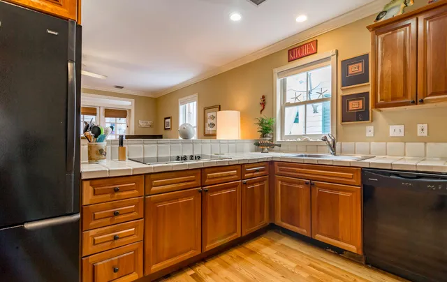 a kitchen with a sink and a refrigerator