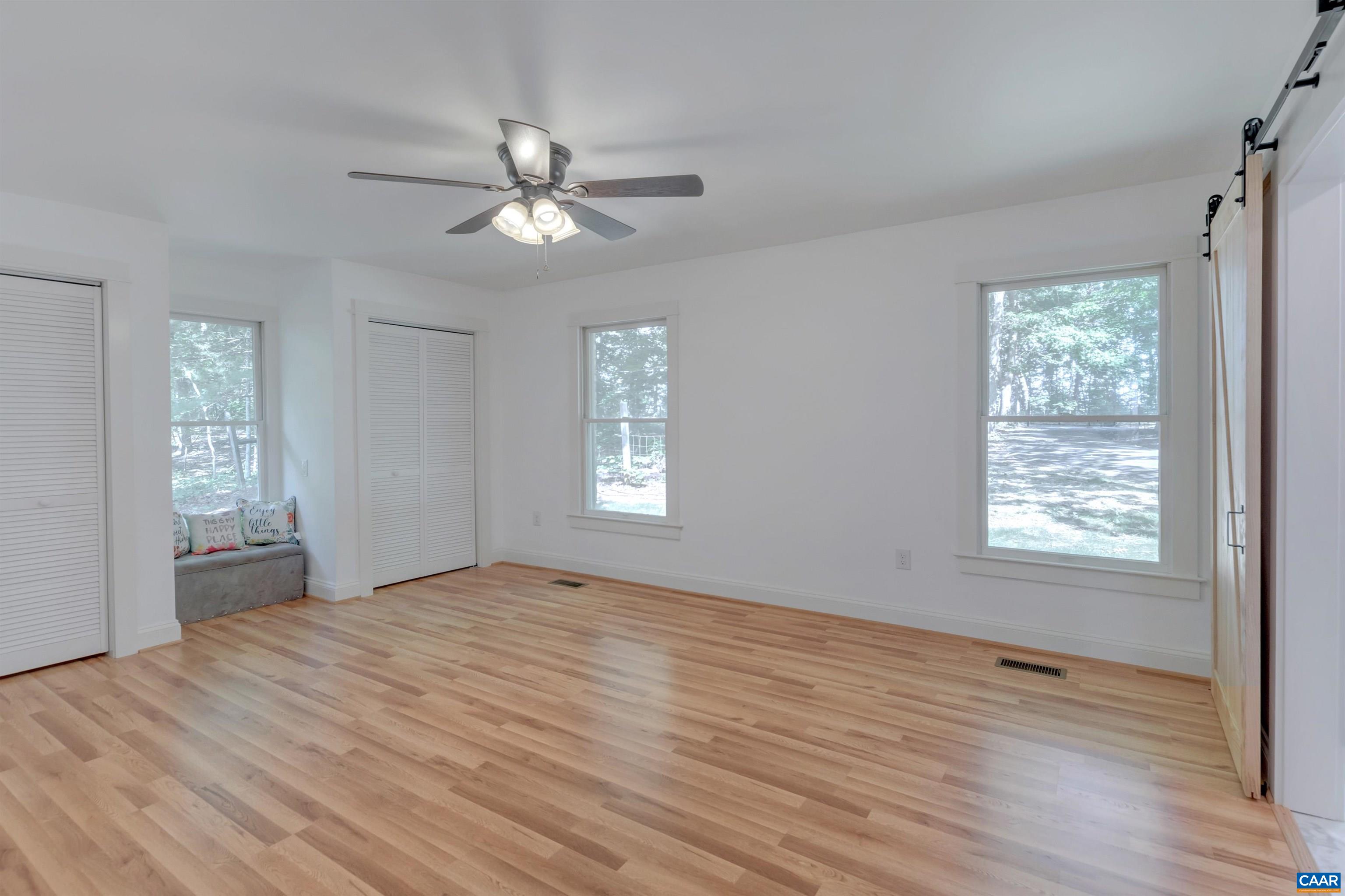 1820 Ridge Road Palmyra, VA 22963 - Photo 22 of 65 a view of an empty room with wooden floor and a window