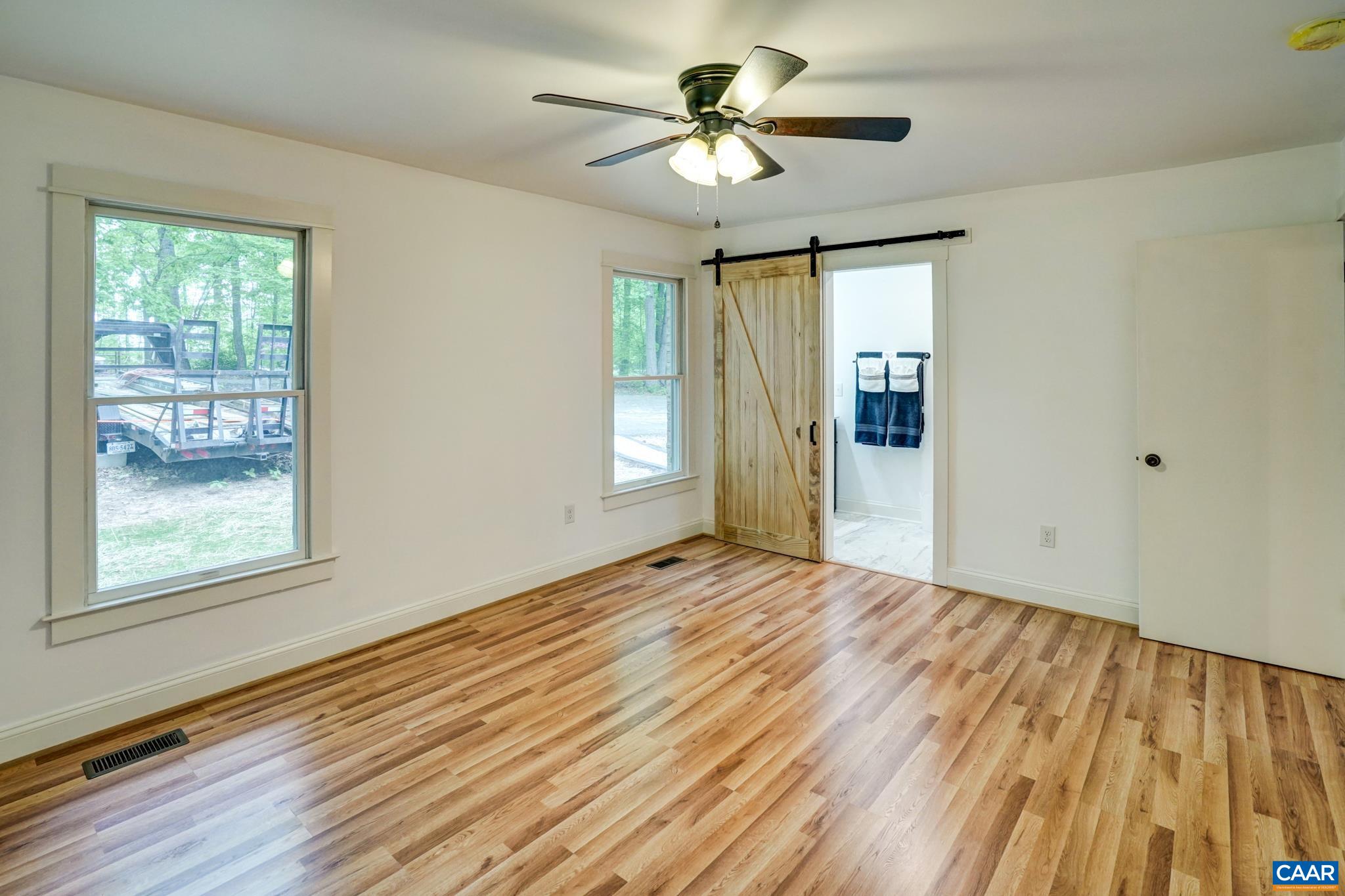 1820 Ridge Road Palmyra, VA 22963 - Photo 26 of 65 a view of an empty room with a window and wooden floor