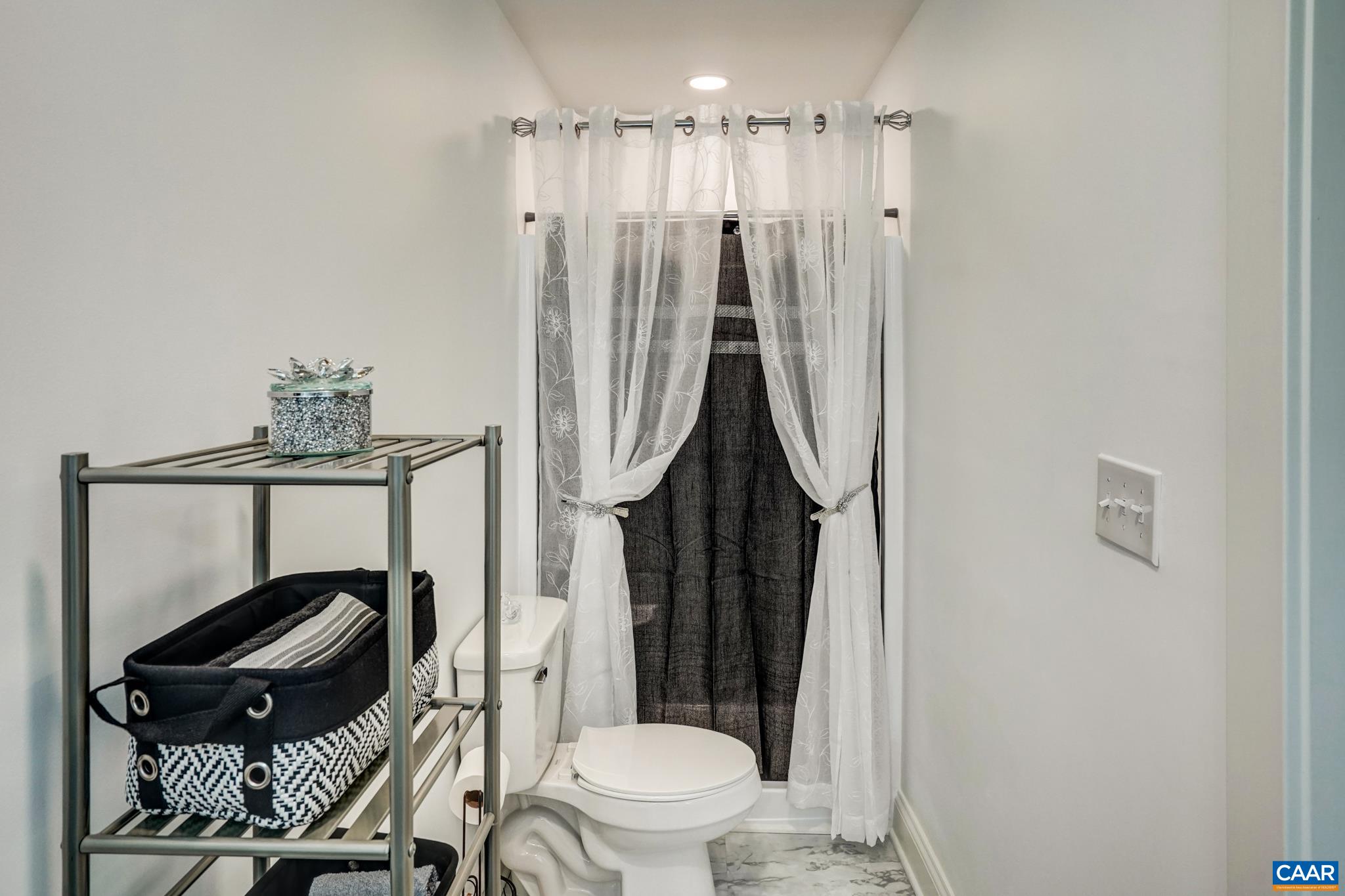 1820 Ridge Road Palmyra, VA 22963 - Photo 29 of 65 a bathroom with a toilet a sink and a mirror