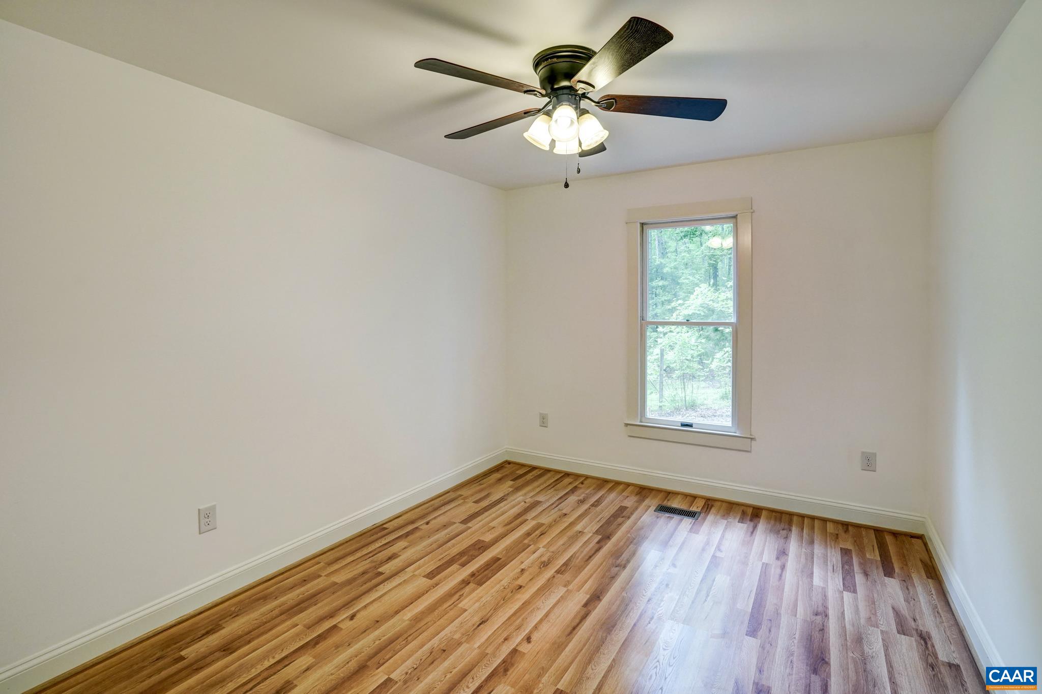 1820 Ridge Road Palmyra, VA 22963 - Photo 30 of 65 an empty room with a window and a fan