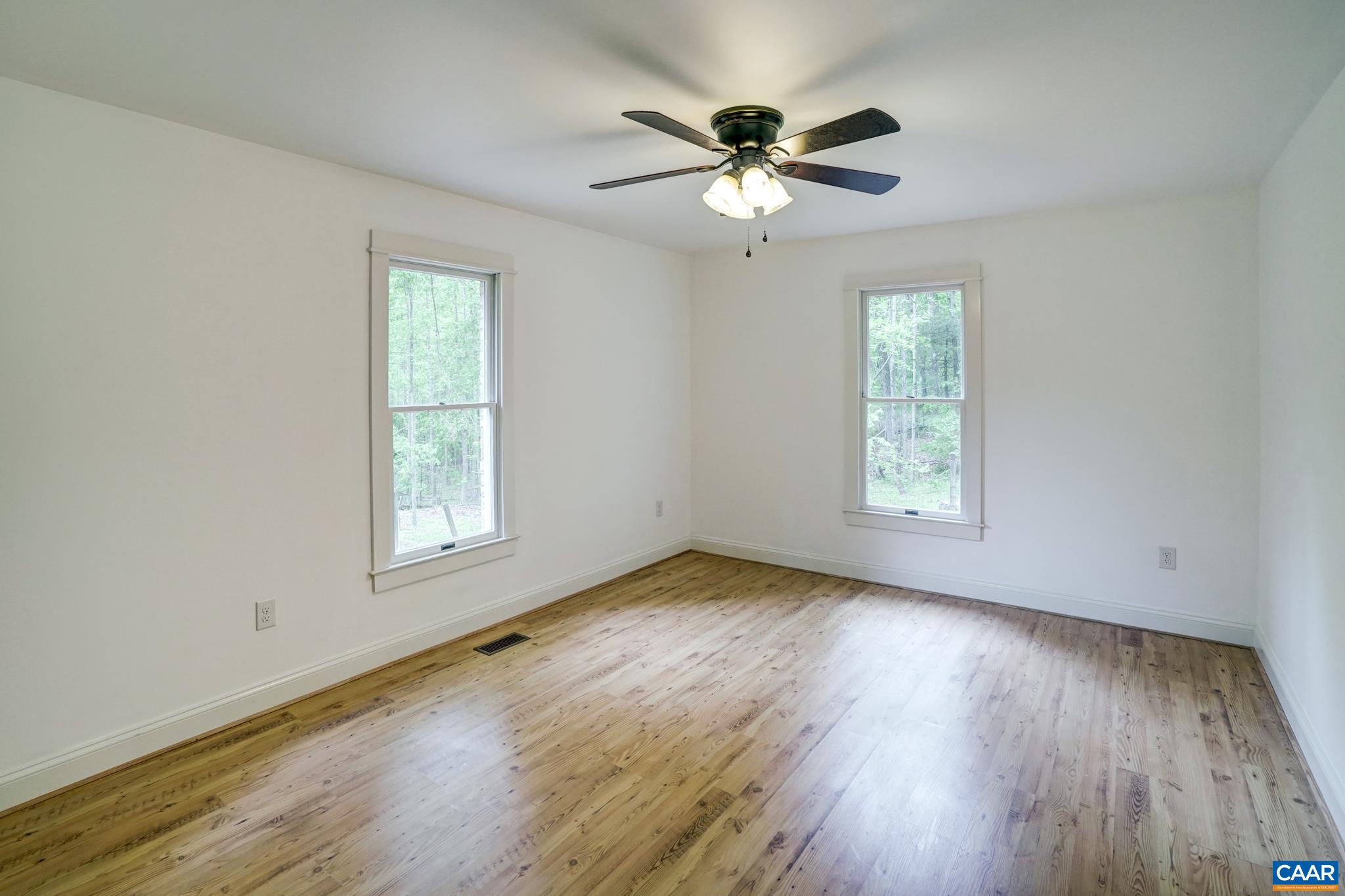 1820 Ridge Road Palmyra, VA 22963 - Photo 32 of 65 a view of an empty room with wooden floor and a window