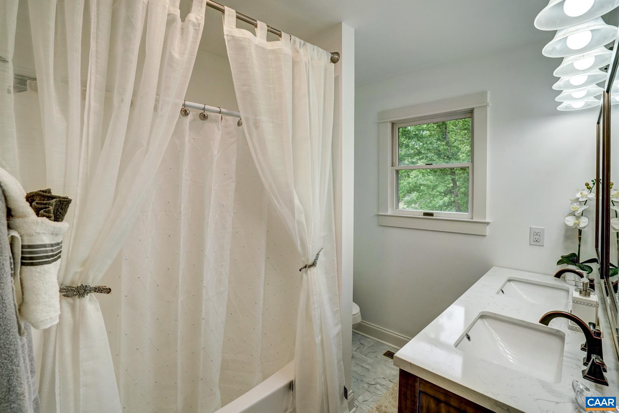 1820 Ridge Road Palmyra, VA 22963 - Photo 34 of 65 a bathroom with a sink and a tub