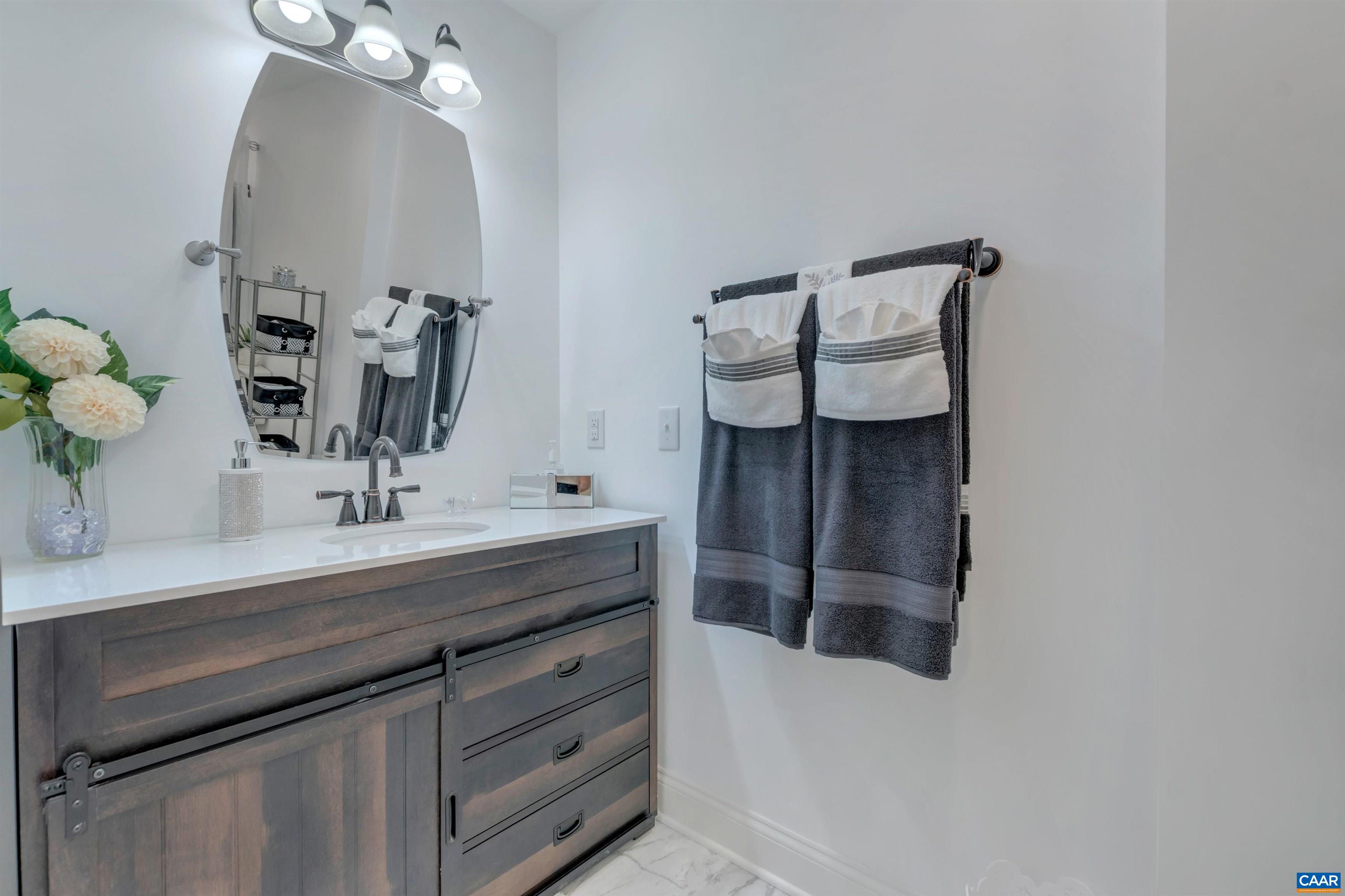 1820 Ridge Road Palmyra, VA 22963 - Photo 37 of 65 a bathroom with a sink and a mirror