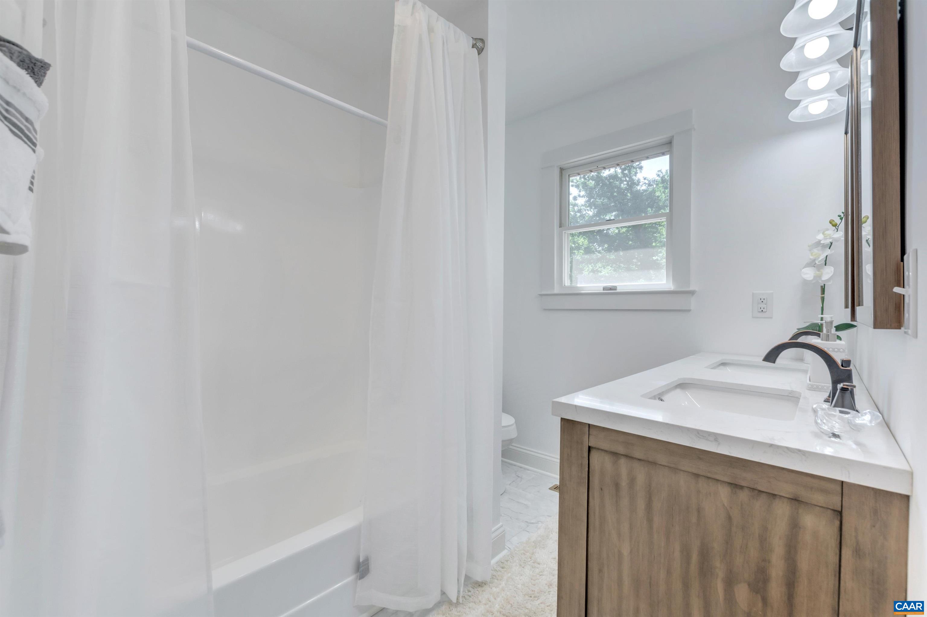 1820 Ridge Road Palmyra, VA 22963 - Photo 43 of 65 a bathroom with a sink and a bathtub