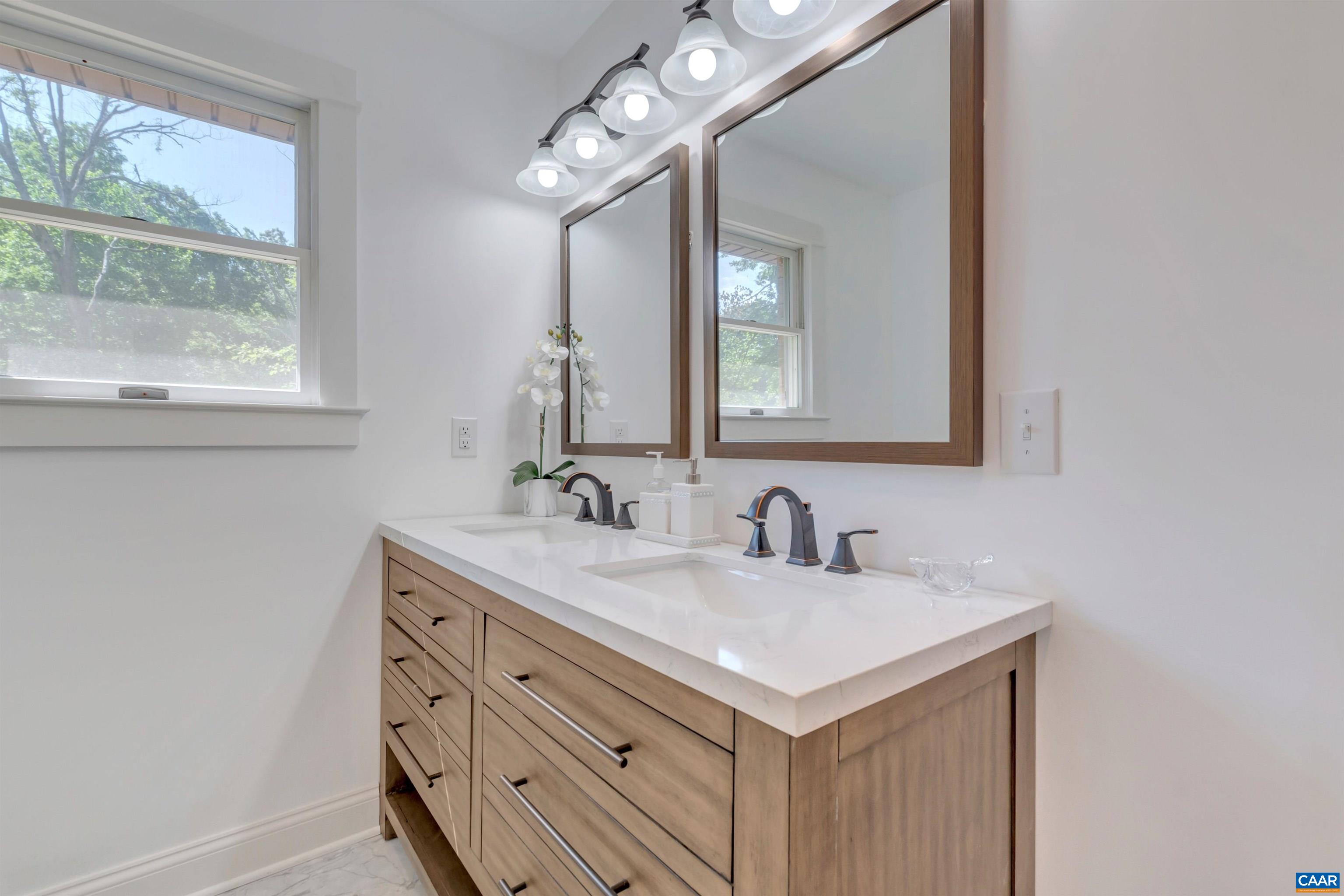 1820 Ridge Road Palmyra, VA 22963 - Photo 44 of 65 a bathroom with a sink and a mirror
