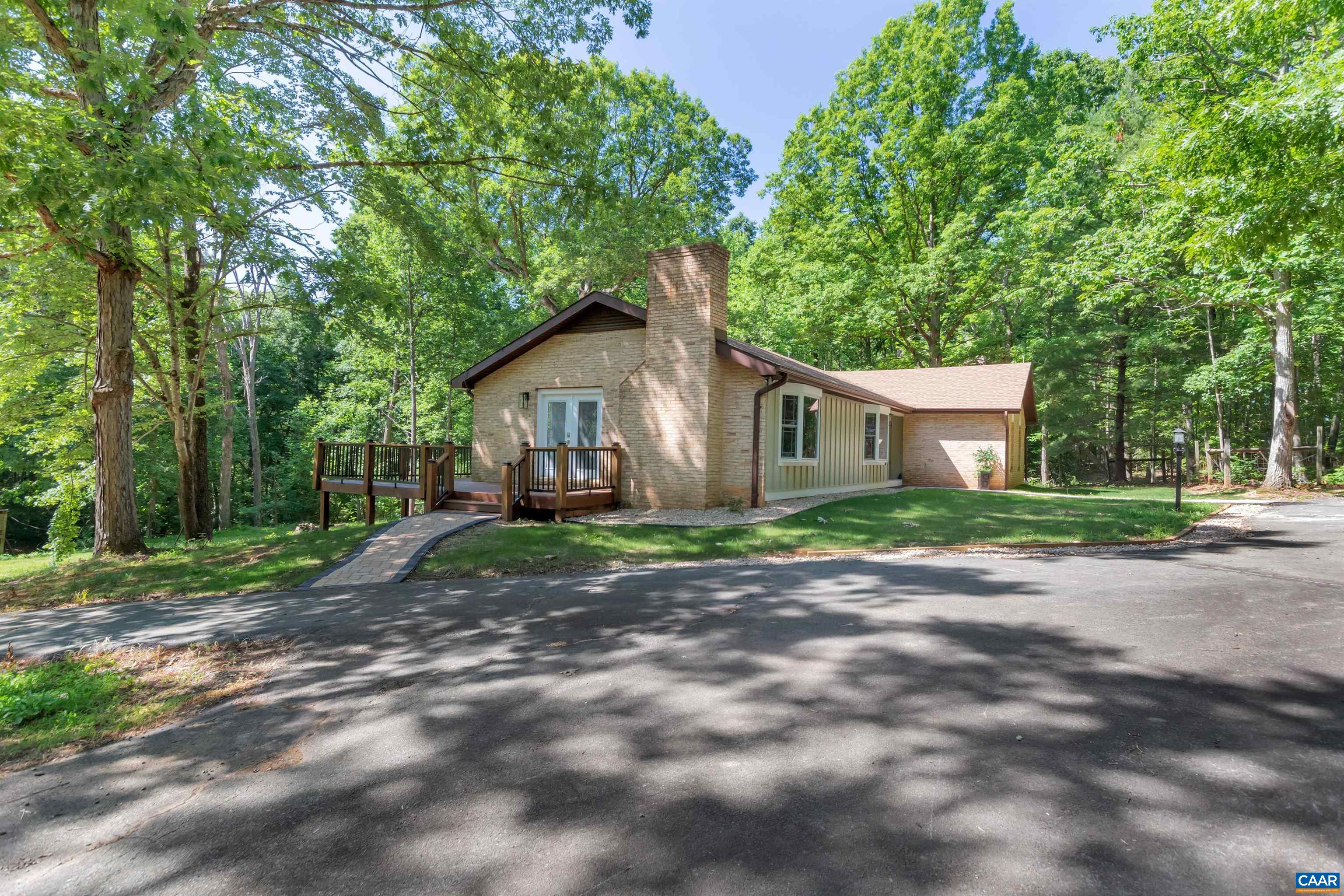 1820 Ridge Road Palmyra, VA 22963 - Photo 54 of 65 a view of a yard in front of a house with large trees