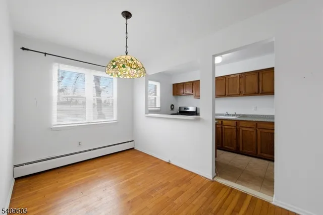 a kitchen with stainless steel appliances granite countertop a stove and a refrigerator