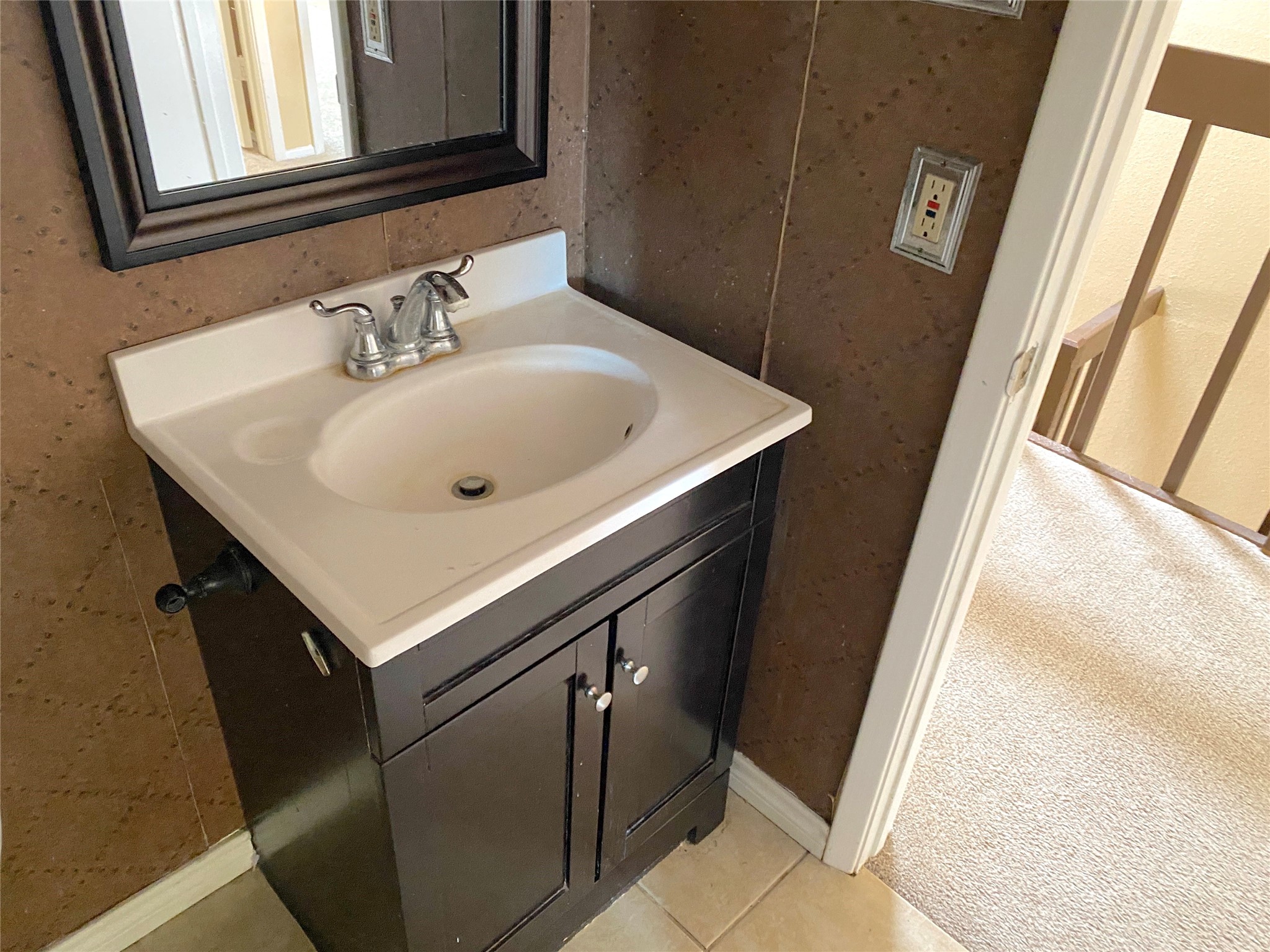 3166 Windchase Boulevard, Unit 465 Houston, TX 77082 - Photo 13 of 21 a bathroom with a sink and a mirror