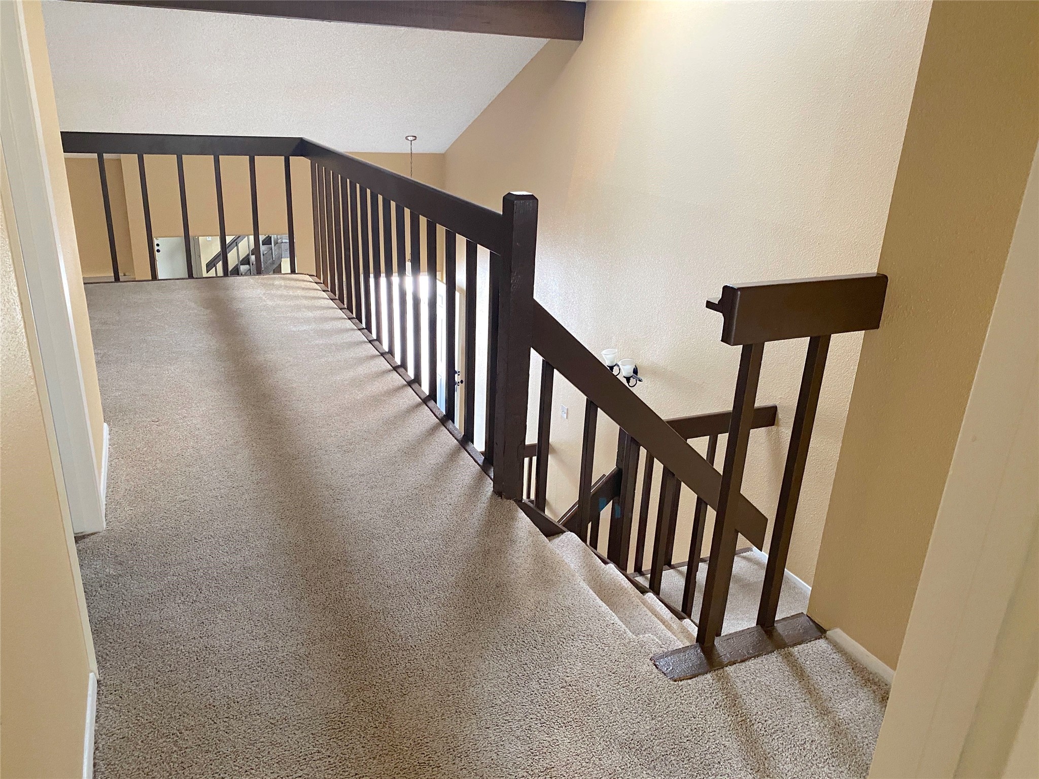 3166 Windchase Boulevard, Unit 465 Houston, TX 77082 - Photo 14 of 21 a view of a hallway with wooden floor and stairs