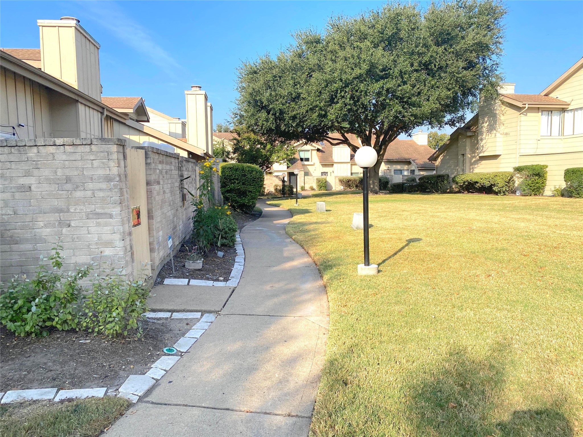 3166 Windchase Boulevard, Unit 465 Houston, TX 77082 - Photo 21 of 21 a view of a street with houses