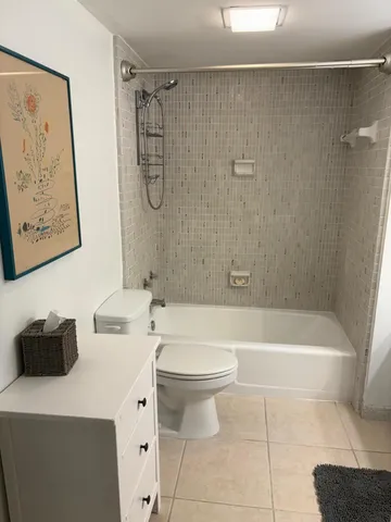 a bathroom with a sink a toilet and a bathtub