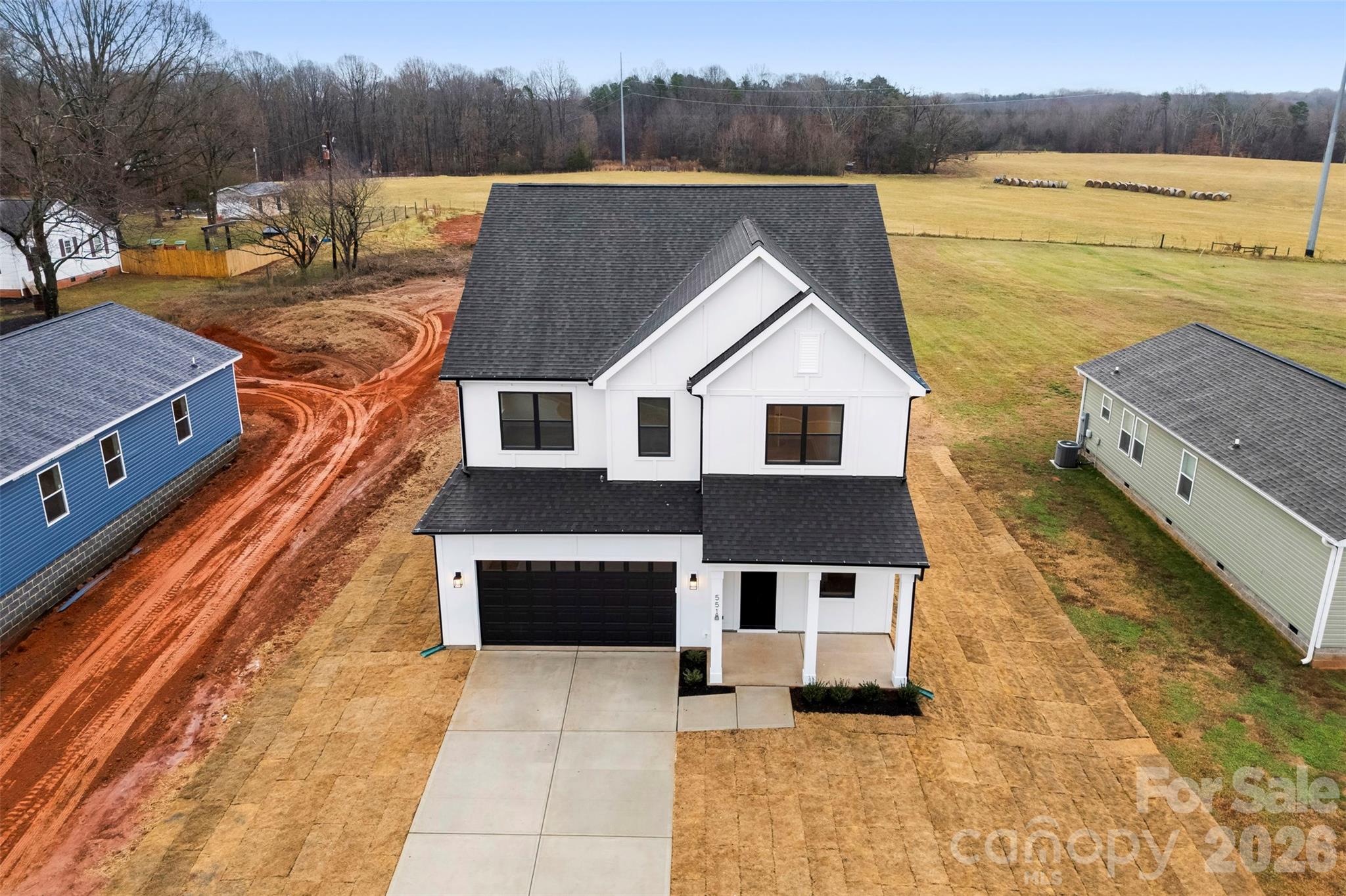 551 Perry Road Troutman, NC 28166 - Photo 47 of 47 a view of a house with pool and a yard
