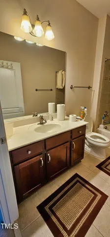 a bathroom with a sink a double vanity and a mirror