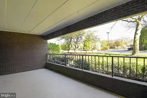 a view of balcony with furniture