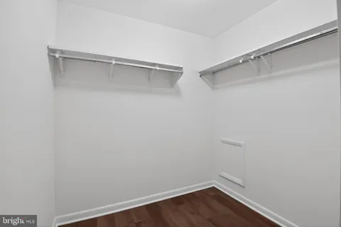a view of an empty walk in closet