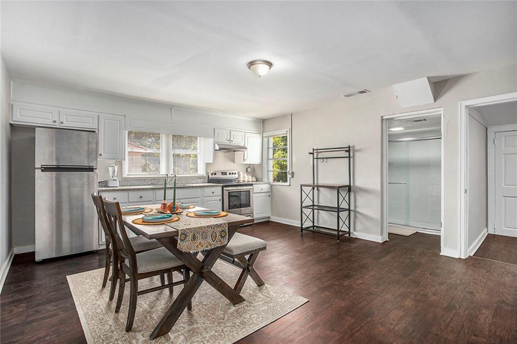 1298 Irwin Bridge Road Northwest Conyers, GA 30012 - Photo 12 of 25 a dining room with furniture and window