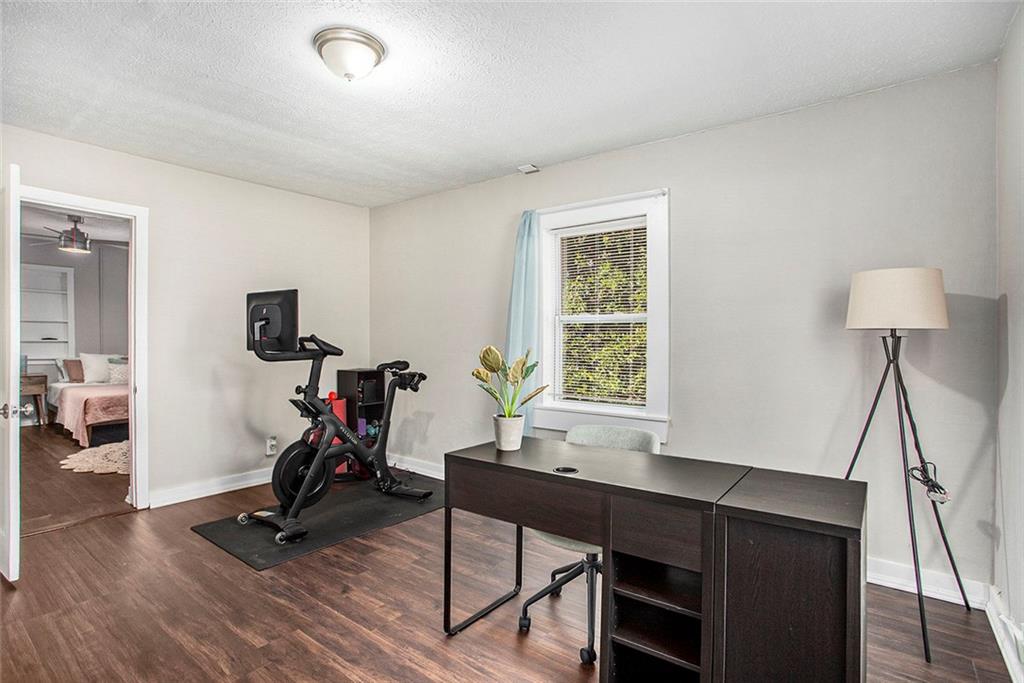 1298 Irwin Bridge Road Northwest Conyers, GA 30012 - Photo 19 of 25 a view of a workspace with furniture and a window