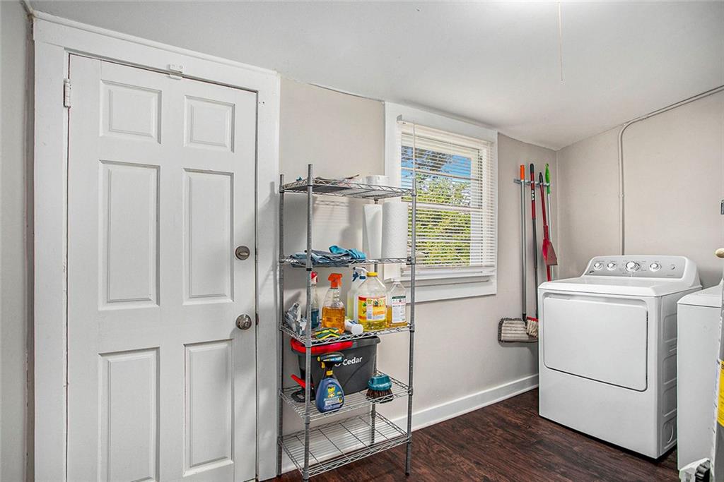1298 Irwin Bridge Road Northwest Conyers, GA 30012 - Photo 21 of 25 a storage room with wooden floor and furniture