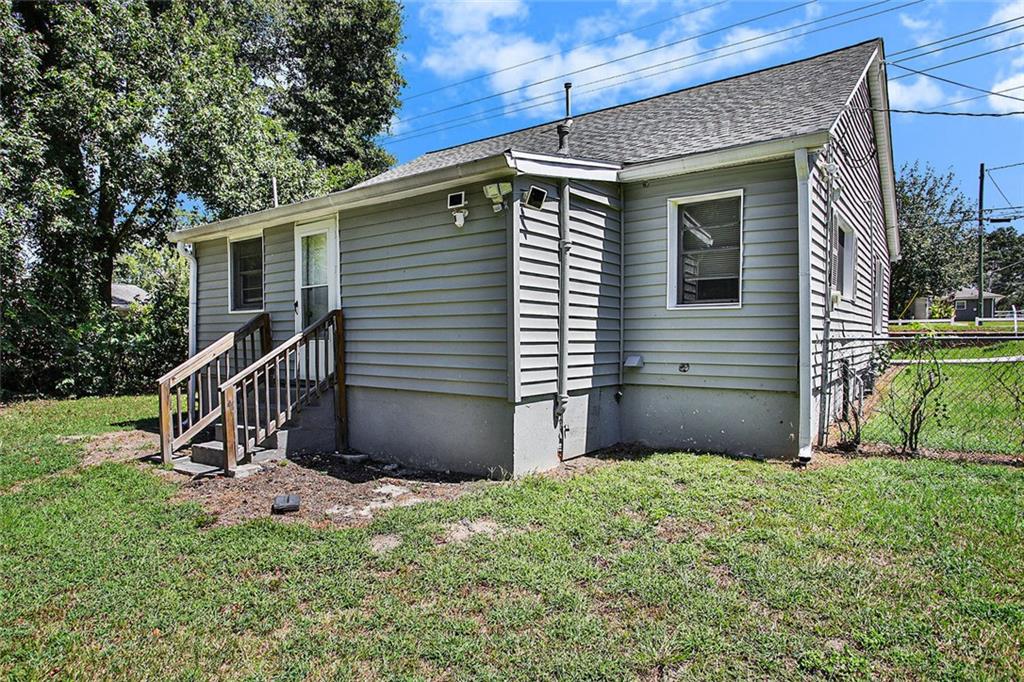 1298 Irwin Bridge Road Northwest Conyers, GA 30012 - Photo 25 of 25 a view of a house with a yard and deck