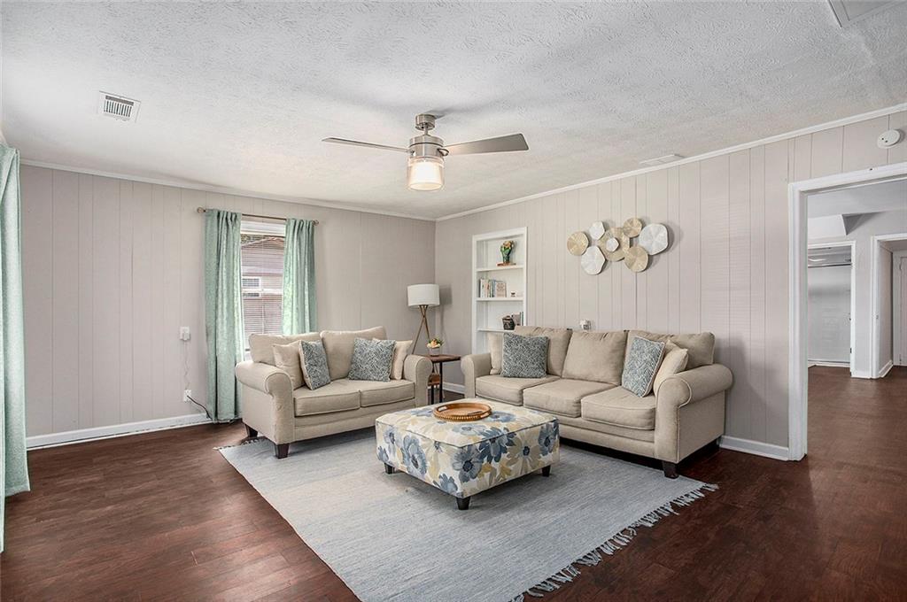 1298 Irwin Bridge Road Northwest Conyers, GA 30012 - Photo 6 of 25 a living room with furniture and a large window