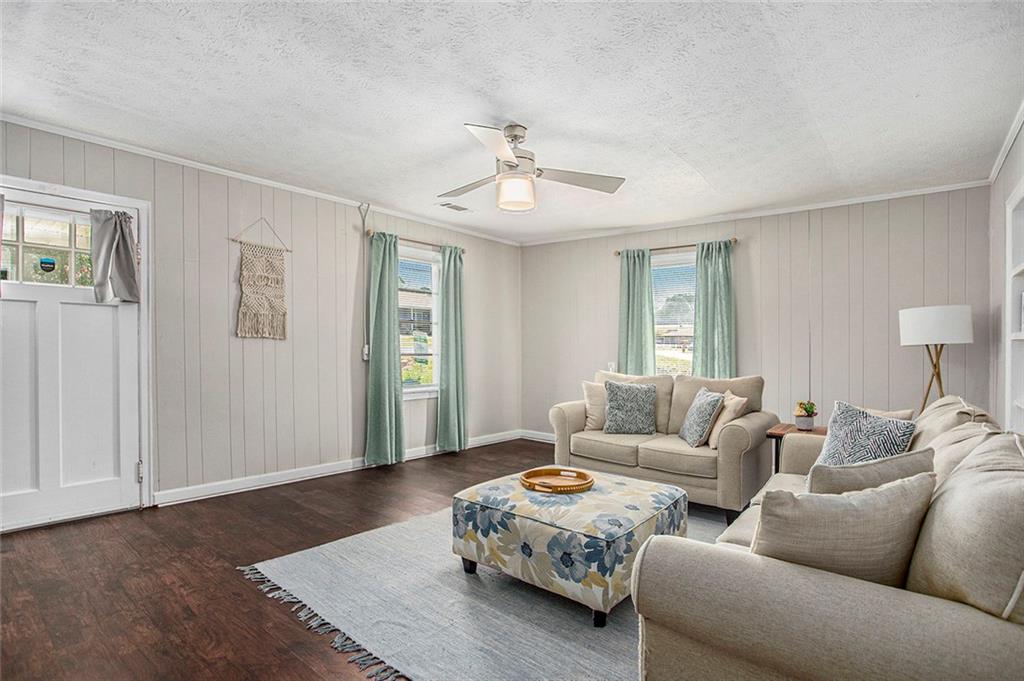 1298 Irwin Bridge Road Northwest Conyers, GA 30012 - Photo 7 of 25 a living room with furniture and wooden floor
