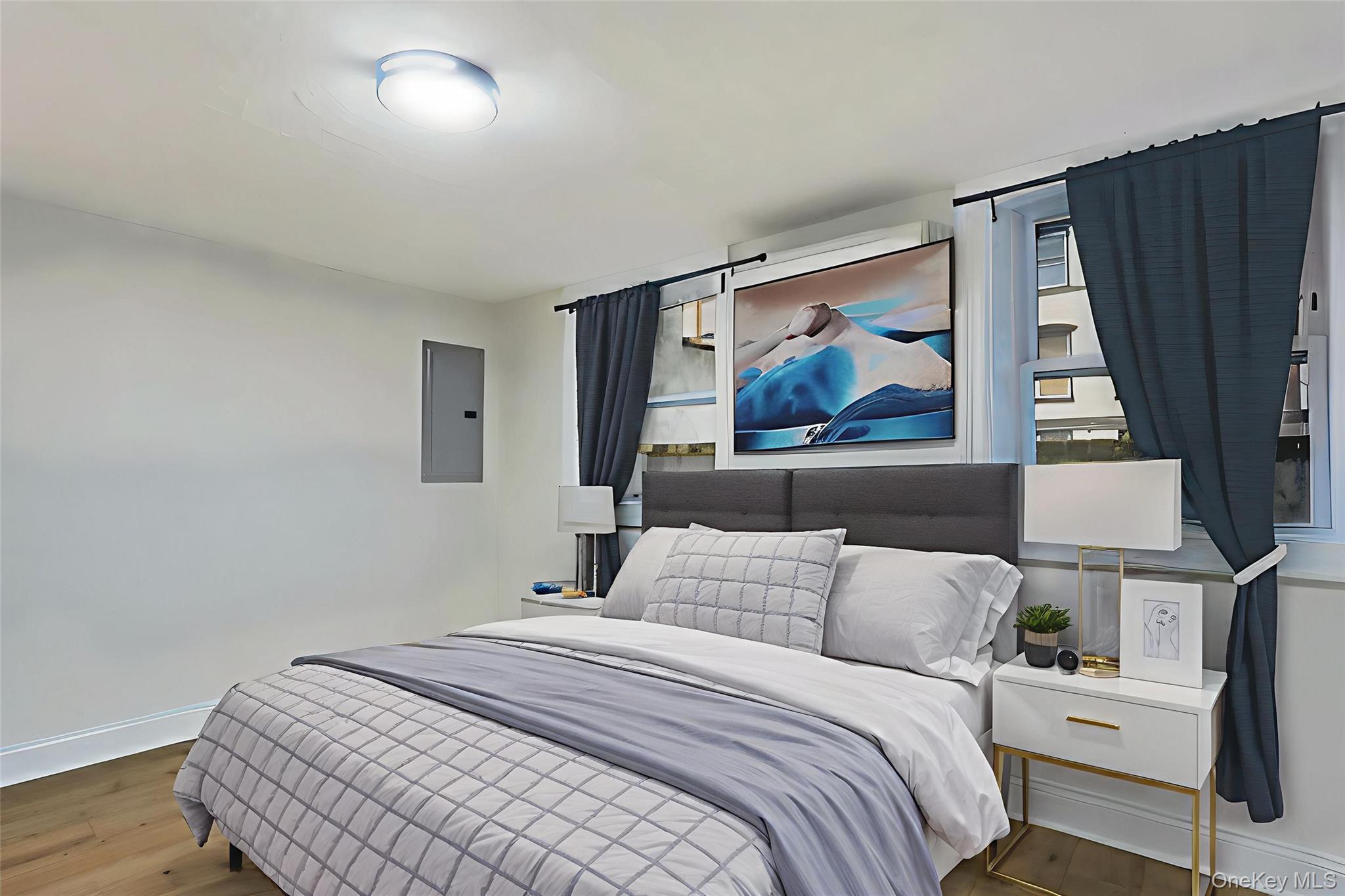 171 Chambers Street Newburgh, NY 12550 - Photo 11 of 39 a bedroom with a bed and a painting on the wall