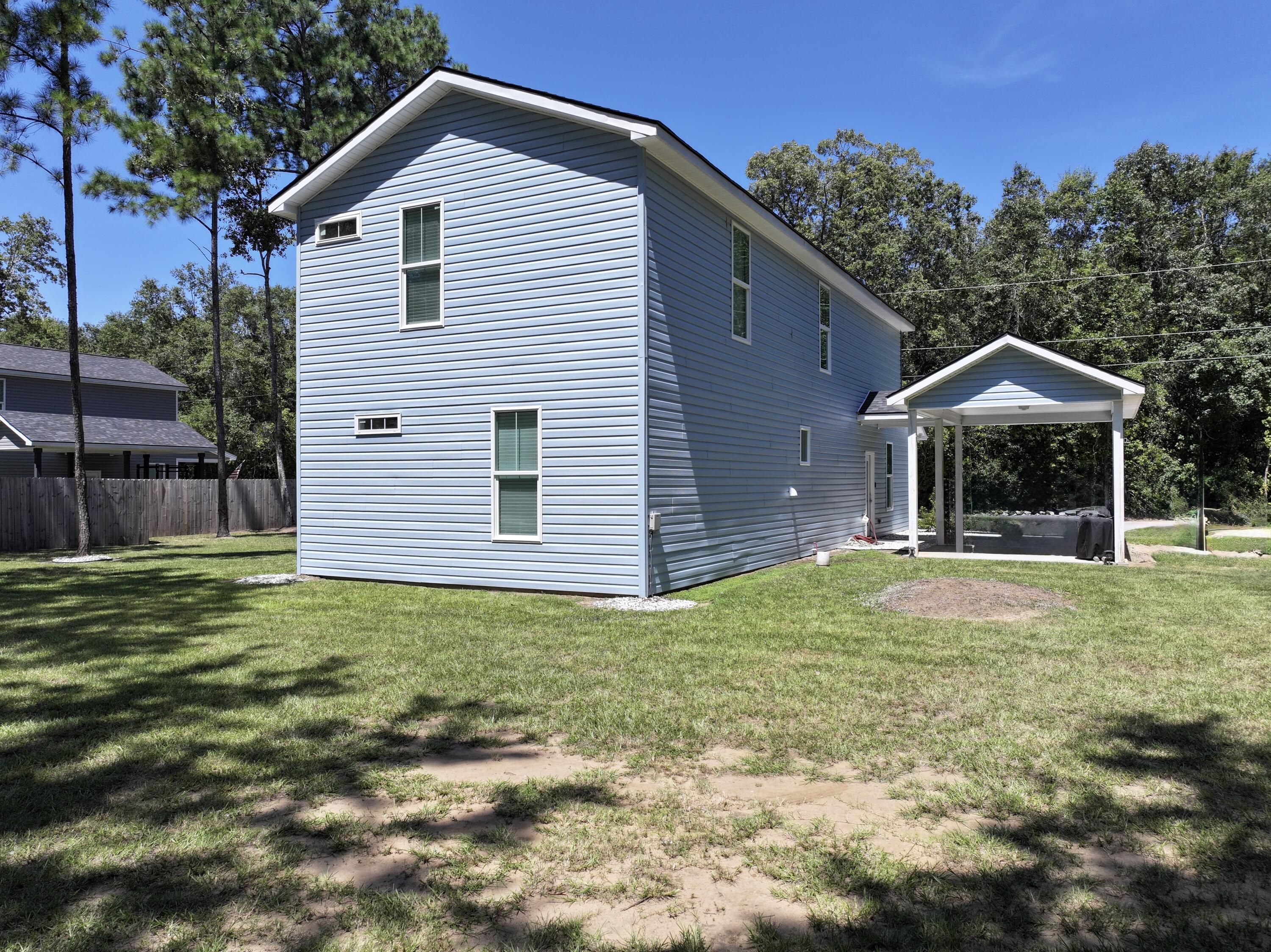 305 Capers Road Walterboro, SC 29488 - Photo 4 of 12 Back left side of the home