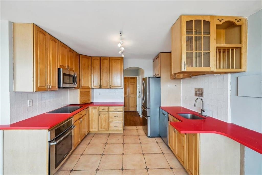 380 Mountain Road, Unit 213 Union City, NJ 07087 - Photo 12 of 24 a kitchen with a refrigerator a sink and dishwasher