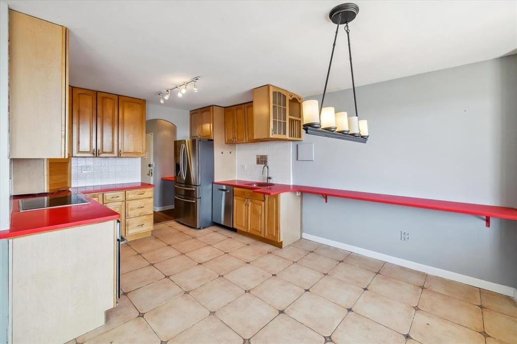 380 Mountain Road, Unit 213 Union City, NJ 07087 - Photo 13 of 24 a kitchen with stainless steel appliances granite countertop a sink and cabinets