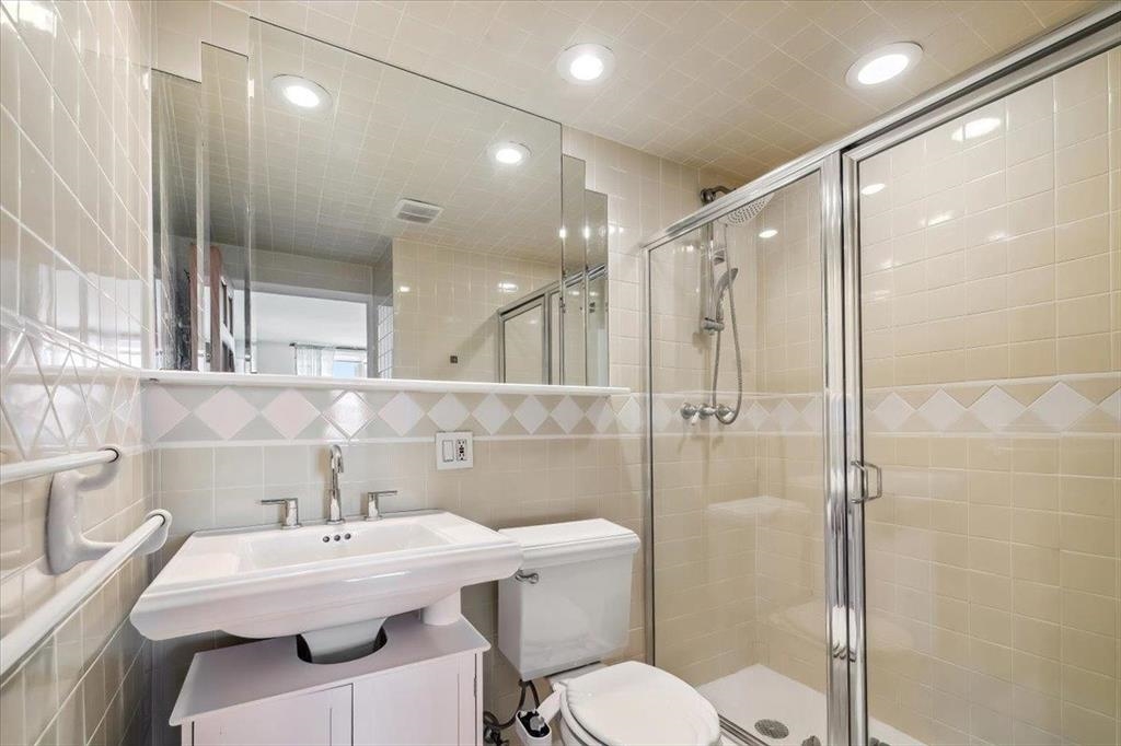 380 Mountain Road, Unit 213 Union City, NJ 07087 - Photo 17 of 24 a bathroom with a sink toilet and shower