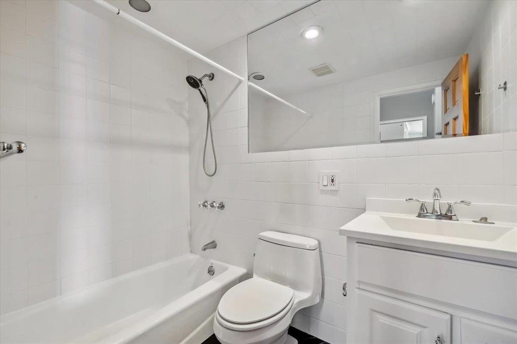 380 Mountain Road, Unit 213 Union City, NJ 07087 - Photo 18 of 24 a bathroom with a sink toilet vanity and shower