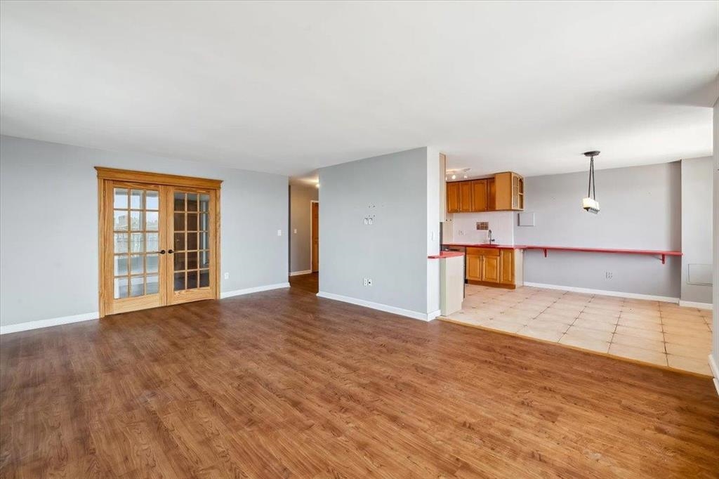 380 Mountain Road, Unit 213 Union City, NJ 07087 - Photo 7 of 24 a view of a room with wooden floor and a window