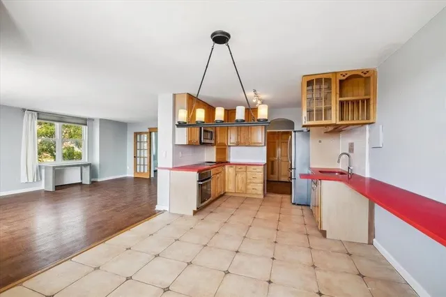 a view of a kitchen with a sink and a window