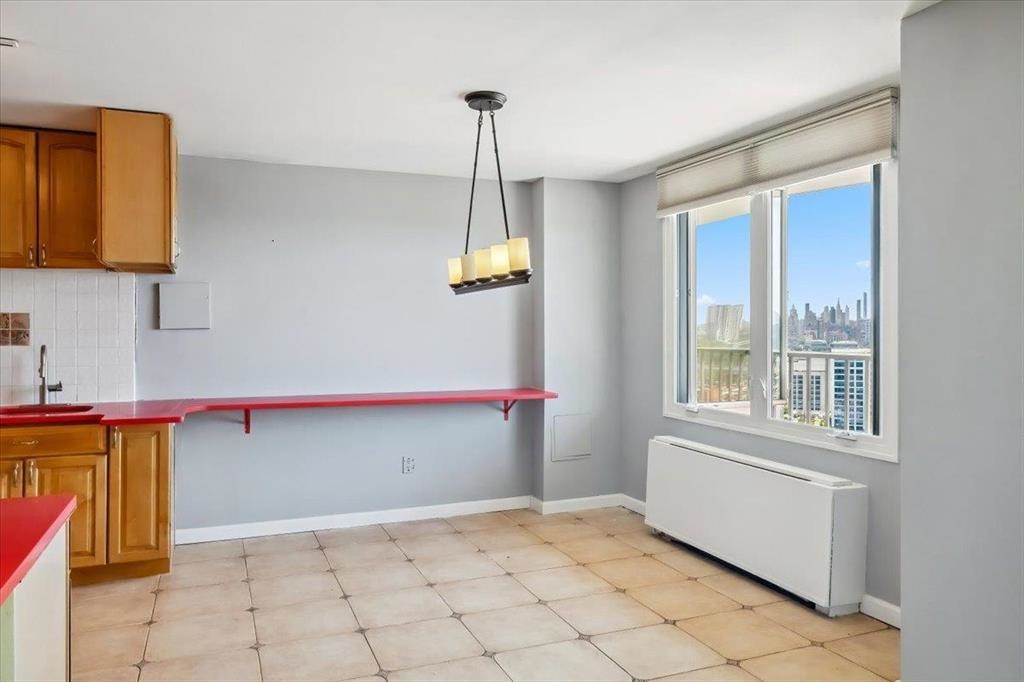380 Mountain Road, Unit 213 Union City, NJ 07087 - Photo 9 of 24 a view of an empty room with a window