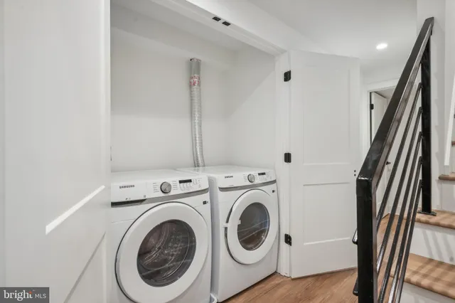a view of bathroom with washer and dryer