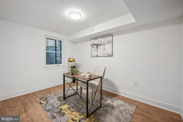 a workspace with furniture and wooden floor