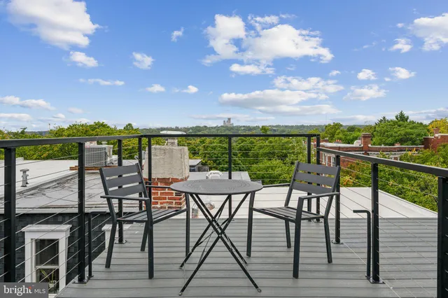 a view of a chairs and table in the terrace