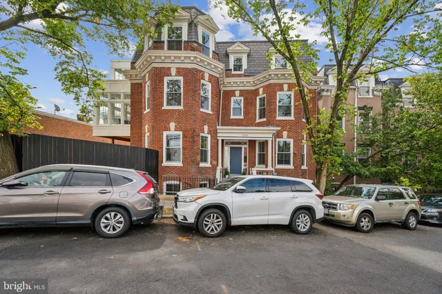 a view of a car parked in front of a house