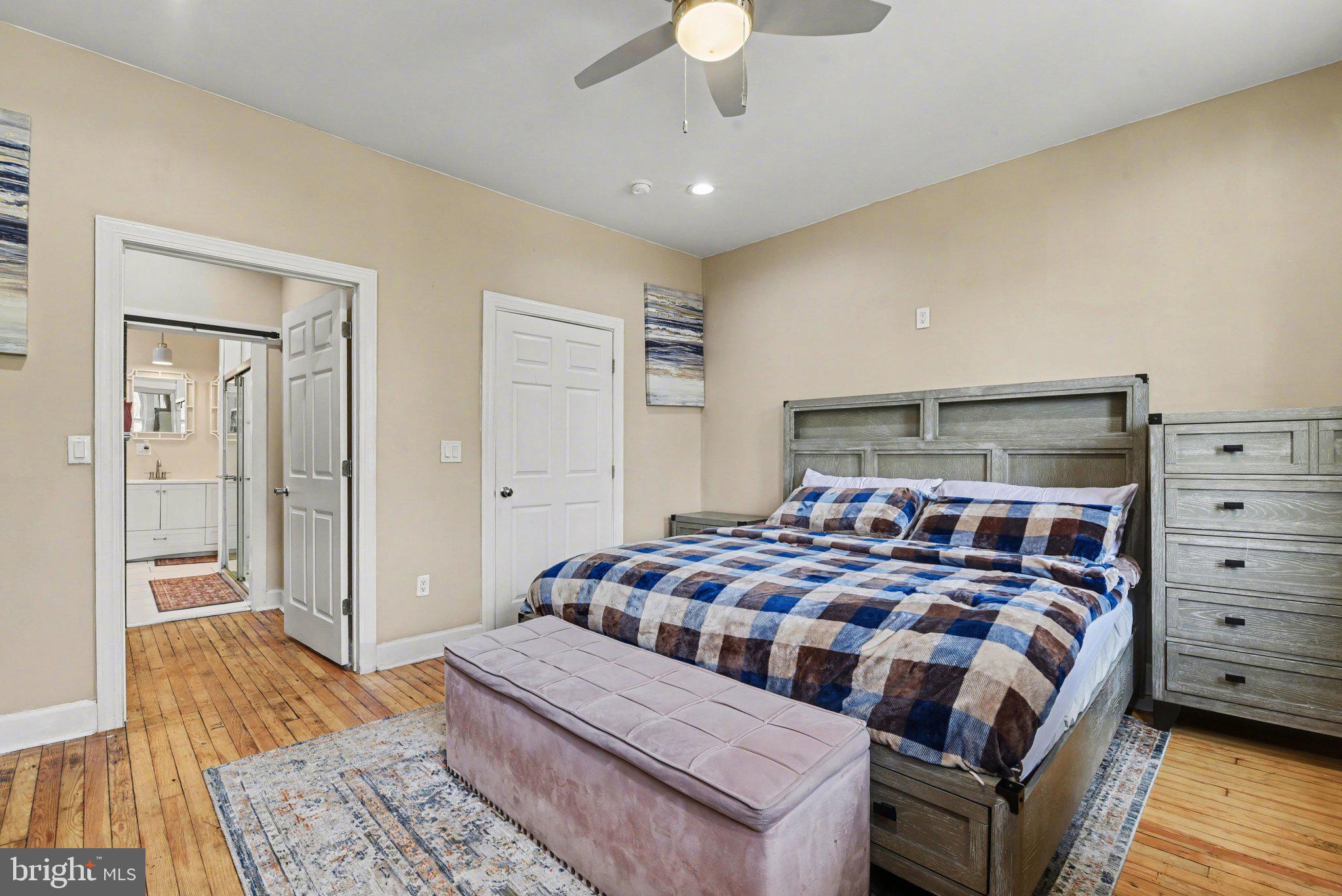 918 North 16th Street Harrisburg, PA 17103 - Photo 13 of 31 a bedroom with a bed and wooden floor