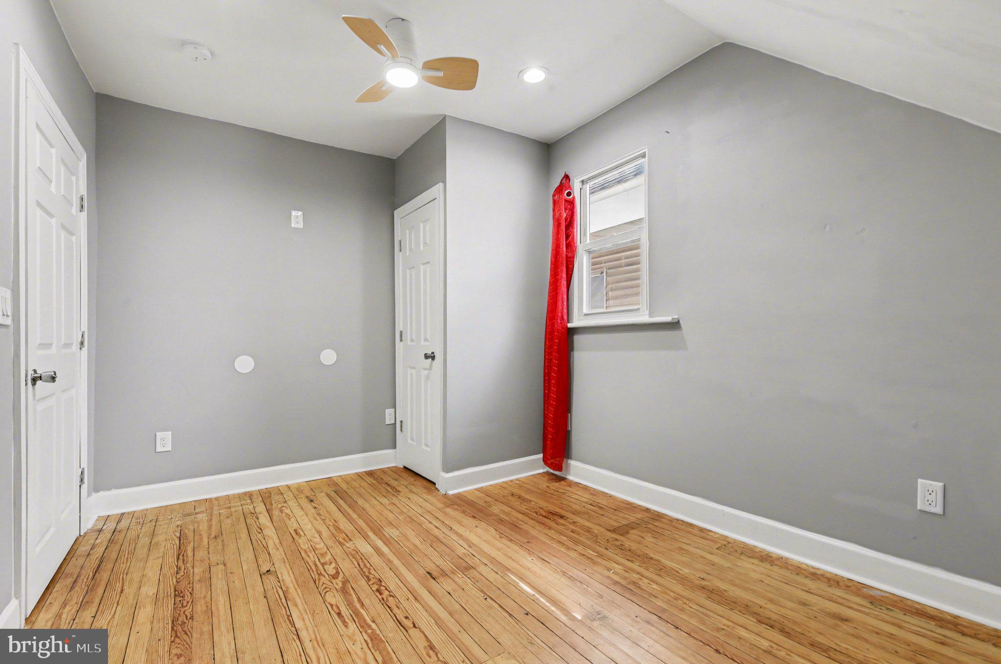 918 North 16th Street Harrisburg, PA 17103 - Photo 23 of 31 an empty room with wooden floor and windows