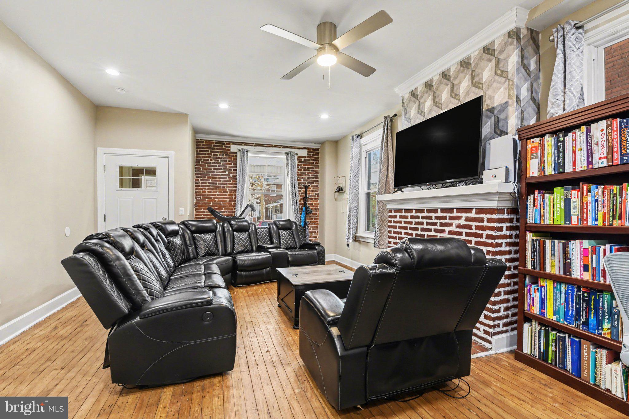 918 North 16th Street Harrisburg, PA 17103 - Photo 6 of 31 a living room with fireplace furniture and a flat screen tv