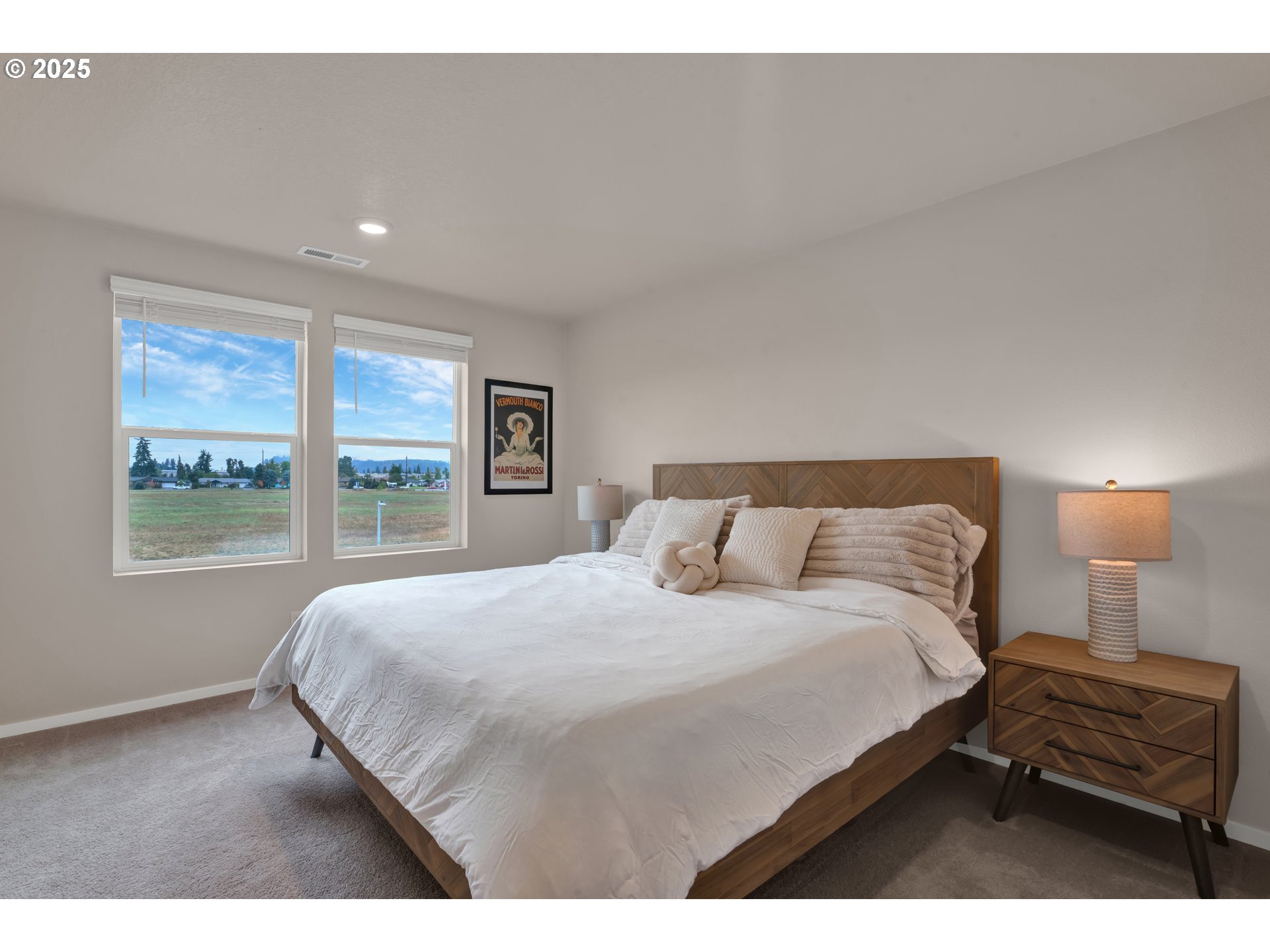 2653 U Street Springfield, OR 97477 - Photo 13 of 32 a bedroom with a bed and a night stand