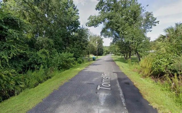 a view of a street with a trees