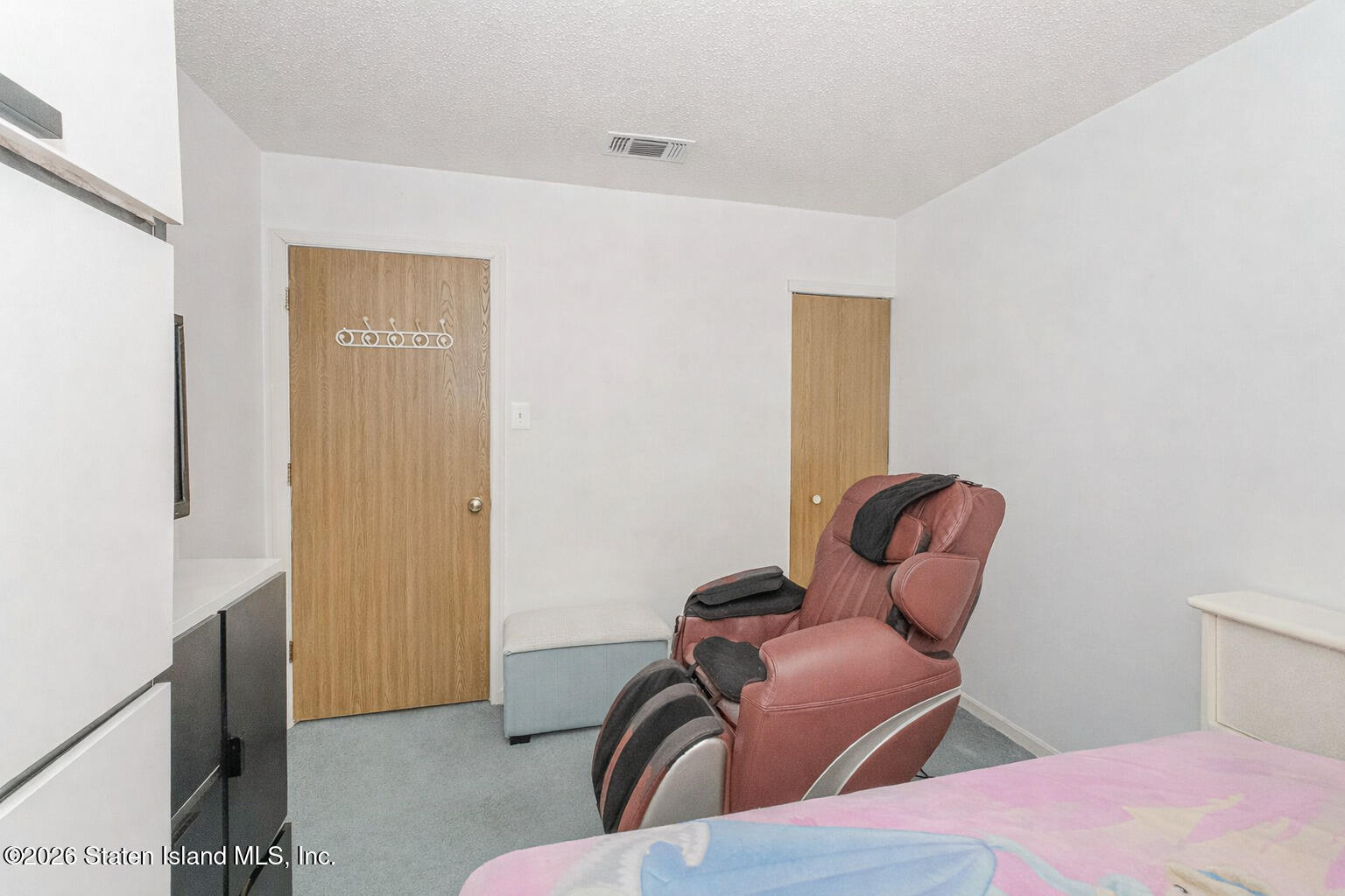 212 Ilyssa Way Staten Island, NY 10312 - Photo 11 of 21 a room with a bed and wooden floor