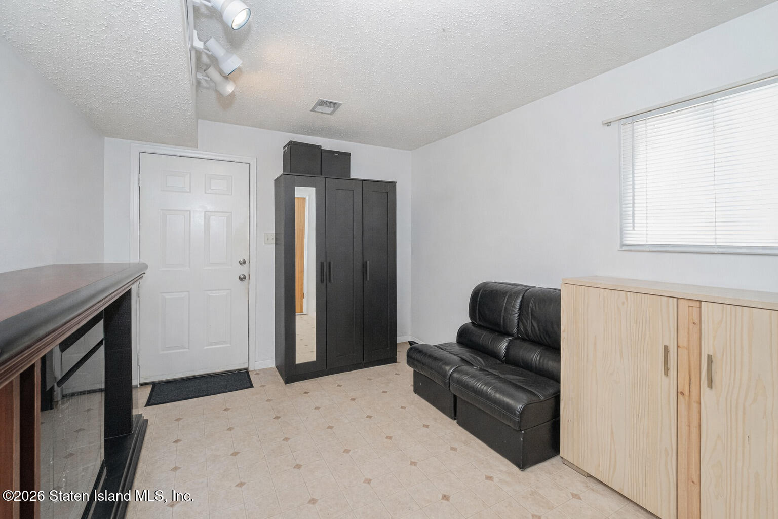212 Ilyssa Way Staten Island, NY 10312 - Photo 4 of 21 a bedroom with a bed and furniture
