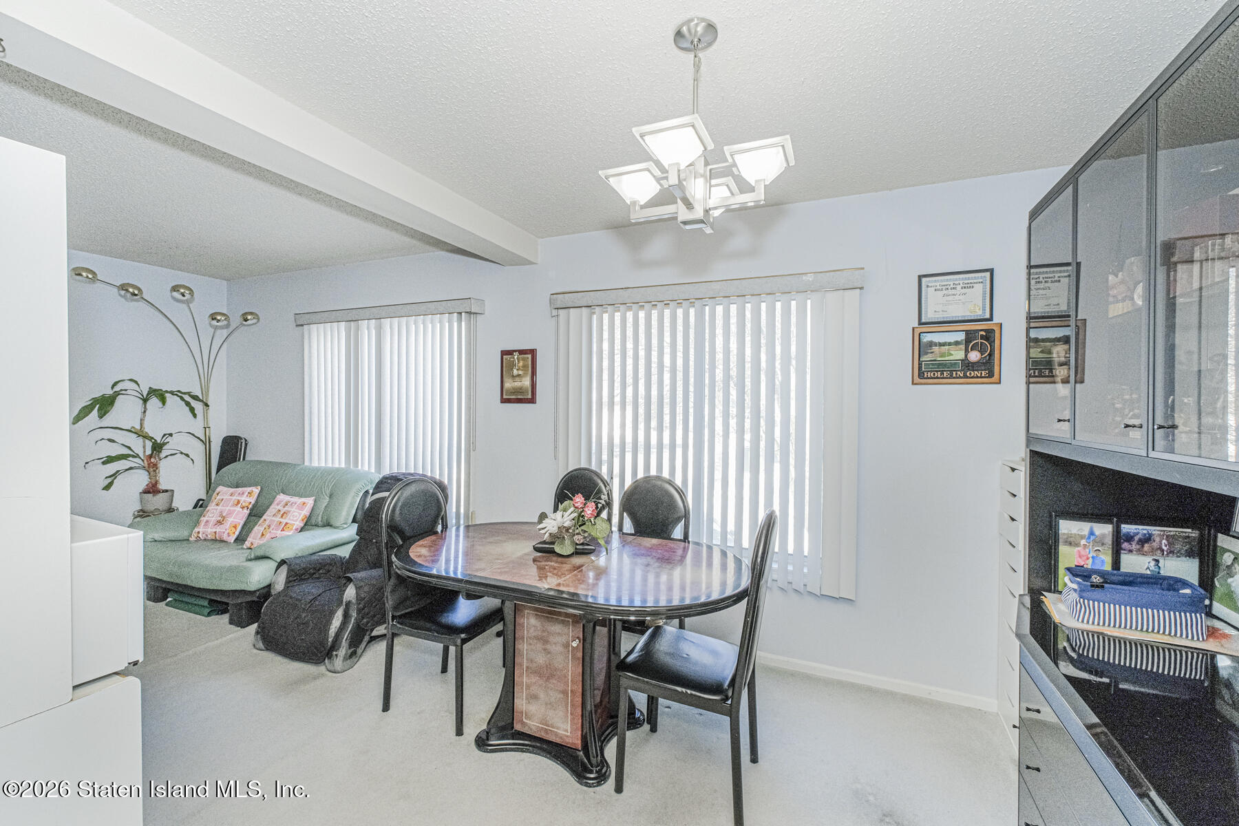 212 Ilyssa Way Staten Island, NY 10312 - Photo 5 of 21 a dining room with furniture and window