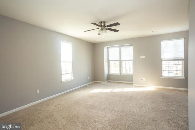 a view of a big room with windows and cabinet