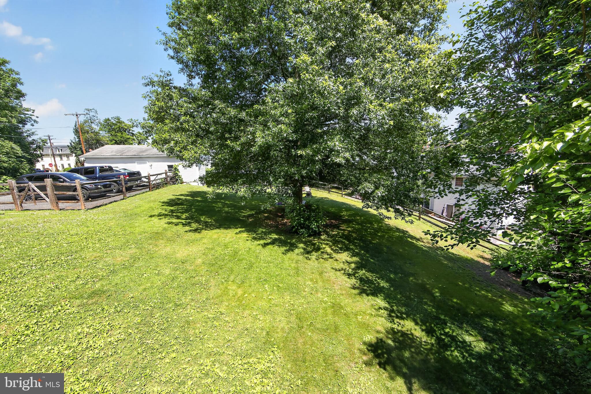238 Brown Street Spring City, PA 19475 - Photo 5 of 57 Lush green yard under a sunny sky.