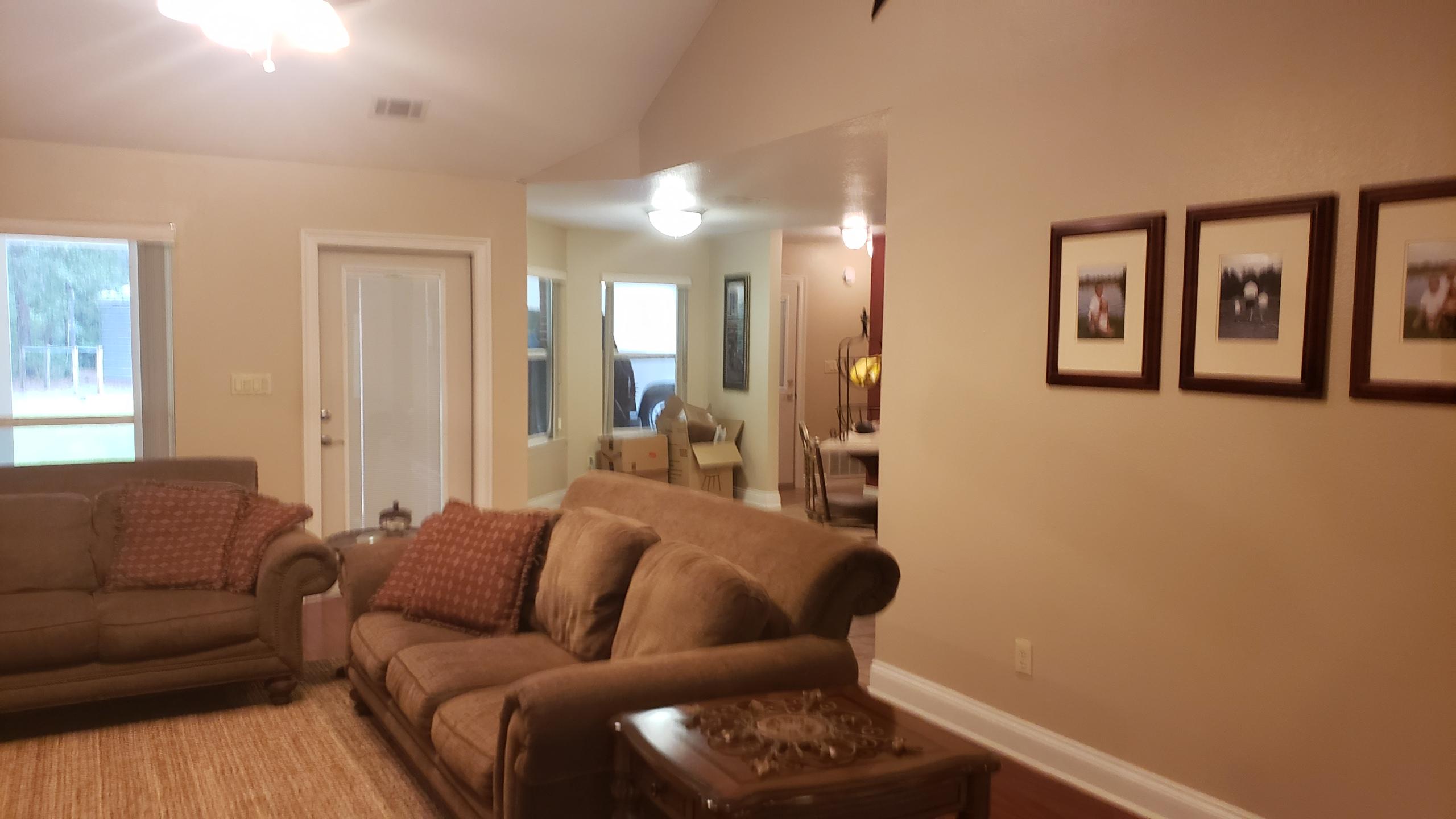 591 Ridge Lake Road Crestview, FL 32536 - Photo 15 of 31 a living room with furniture and large window